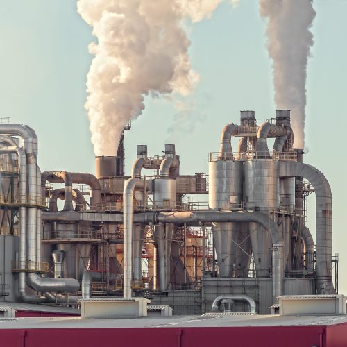 Chemical plant. Silos and smokestacks of a factory.